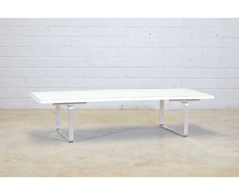 A William Plunkett coffee table,with a white Formica-mounted rectangular top, 152.5cm wide 61cm deep36.5cm highProvenance: Th