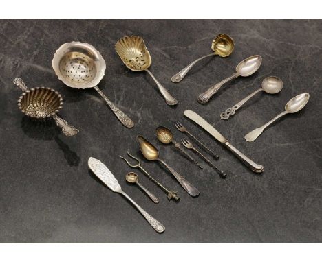 A small collection of silver flatware,mostly Continental, to include a sifter, a tea strainer, marked 900, a French Fiddle pa