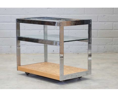 A Merrow Associates chrome and glass drinks trolley,1970s, with two glass shelves, the base with a cork undertier, raised on 