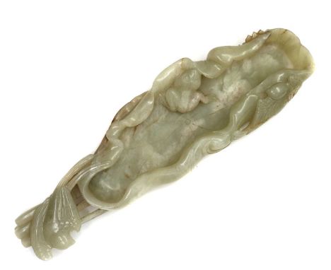 A Chinese jade brush lick, in the shape of a lotus leaf 23cm longCondition ReportNo obvious faults