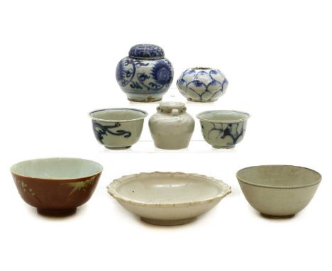 A collection of Chinese pottery,Ming to Qing dynasty, comprising two blue and white cups, the largest 6.5cm diameter, a blue 