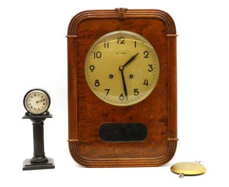 A mahogany wall clock,marked 'Westerstrand', 42cm hightogether with a H.A.C clockOn an ionic column,21.5cm high (2)Provenance
