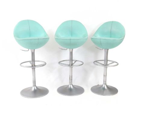 A set of three contemporary bar stools,upholstered in a light blue vinyl fabric, with rise and fall seat mechanisms, 52.5cm w