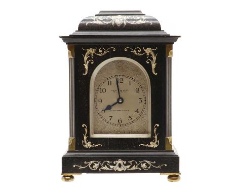 An ebonised and ivory inlaid French style mantel clock, c.1900, by John Walker Ltd, in the North Italian style, the silvered 