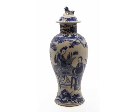 A Chinese blue and white vase and cover,Guangxu (1875-1908), of baluster form, painted with ladies and an attendant in a gard