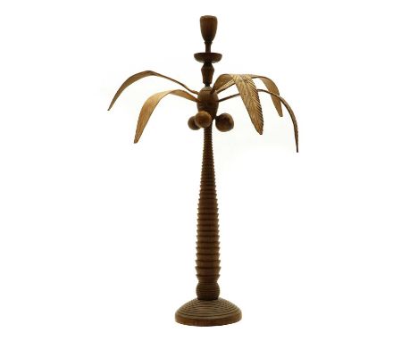 A palmwood coconut tree centrepiece, 20th century, mounted with a candle sconce, turned 'trunk' with carved coconuts and leav