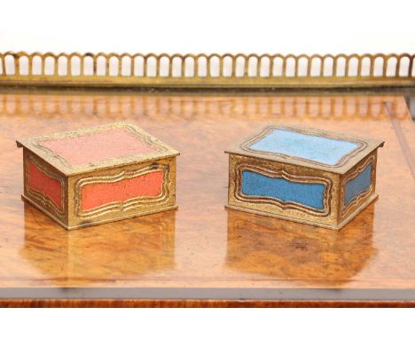 A pair of Tiffany Studios 'His and Hers' stamp boxes,early 20th century, each with enamelled blue and pink panels, to gilt me