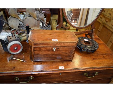 A 19th century mahogany and line inlaid tea caddy, 30.5cm wide. 