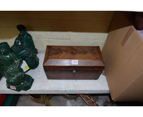 An early 19th century mahogany and line inlaid sarcophagus form tea caddy, 30.5cm wide.