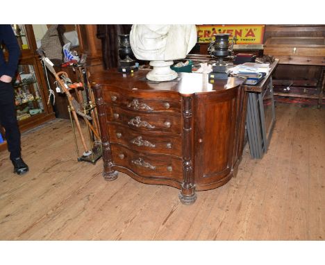 A 19th century Continental figured walnut and faux grained commode, of serpentine outline with four long graduated drawers fl