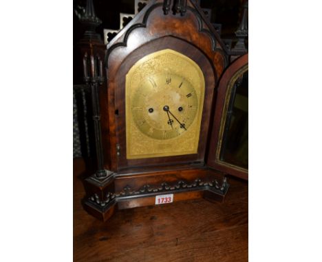 A 19th century Gothic figured walnut mantel clock, by Barraud & Lunds, the gilt dial inscribed and numbered 1831, the gong st