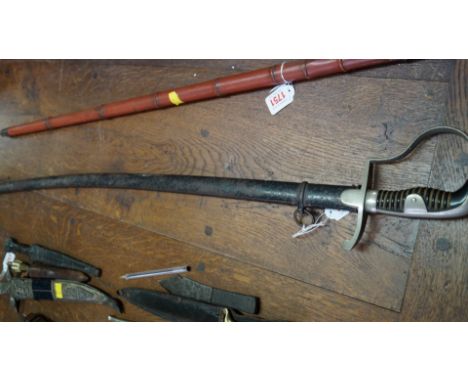An old cavalry type sword and metal scabbard.  Condition Report: Length of scabbard: 86 cm.  No dents but it is not in the be