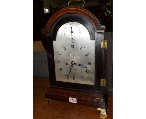 A George III stained fruitwood and brass mounted bracket clock, the 6¾in arched silvered dial inscribed 'H Brown, Havant' (Ha