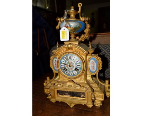A late 19th century, Louis XVI style, gilt metal and Sevres style mantel clock, 34cm high, (s.d.).