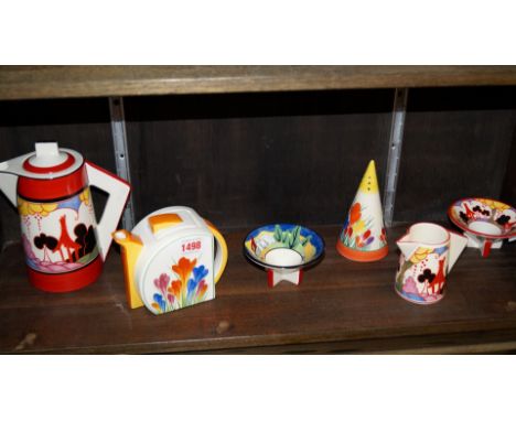 Six reproduction Clarice Cliff items, to include four Wedgwood examples. 