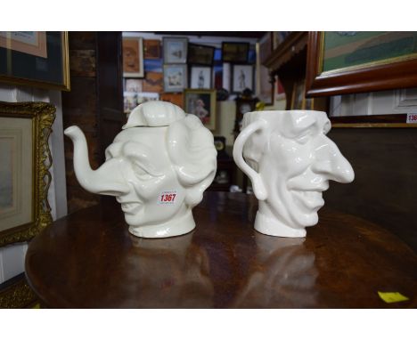 A Spitting Image 'Maggie Thatcher' and 'Prince Charles' teapot and jug set. Condition Report: MRS THATCHER   Has a chip under