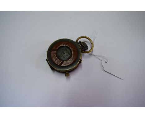 A WWI brass compass, inscribed 'Anglo-Swiss Association, No.36690, 1915', with government broad arrow; together with related 