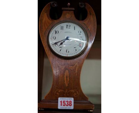 An Edwardian mahogany and inlaid mantel clock, the dial inscribed 'Hawley & Co., 123 Regent Street', 29cm high.  Condition Re
