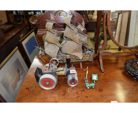 A Mamod live steam traction engine; together with a Lesney tractor and trail; a Triang railway signal; and a painted galleon.