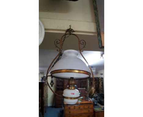 A opaque glass and brass hanging oil lamp, converted. 