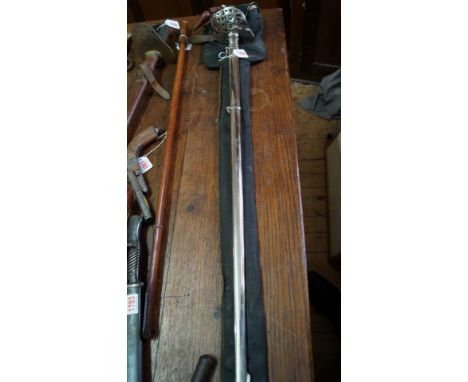 An old bamboo shooting stick, with cane seat; and two others. 