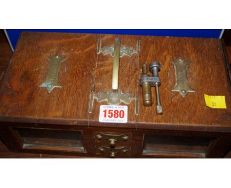 An early 20th century oak and brass mounted combined cigar and cigarette box, 28cm wide; together with a lighter part. 