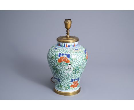 Title: A Chinese lamp mounted wucai vase with floral design, 19th C.Description: H 44,5 cm