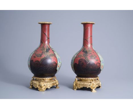 Title: A pair of gilt bronze mounted Japanese lacquered porcelain vases, Meiji, 19th C.Description: H 44,8 cm