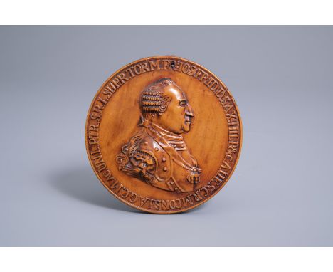 Title: A palmwood medallion with the profile portret of Prince Frederick Josias of Saxe-Coburg-Saalfeld and an allegorical sc