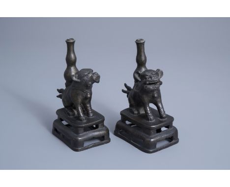 Title: A pair of Chinese bronze joss-stick holders modelled as Buddhist lions, MingDescription: H 18,3 cm