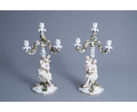Title: A pair of polychrome decorated Saxon porcelain four-light candelabra, Sitzendorf mark, 20th C.Description: H 48 cm