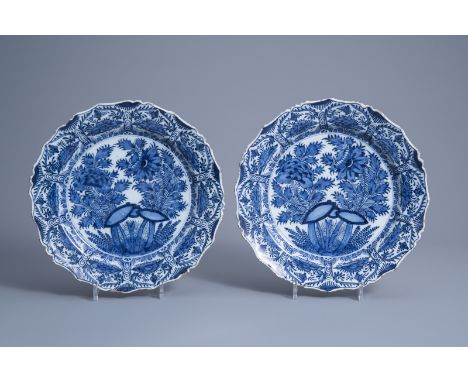 Title: A pair of Dutch Delft blue and white accolade shaped dishes with floral design, 18th C.Description: Dia.: 30,7 cmÊ Ê M
