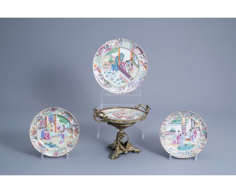 Title: Four Chinese Canton famille rose plates, one with a gilt bronze mount, 19th C.Description: H 21 cm (the centerpiece)Ê 
