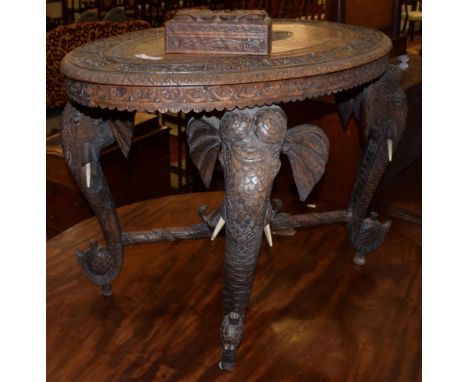 An early 20th century carved hardwood elephant table; and a small carved trinket box (2)