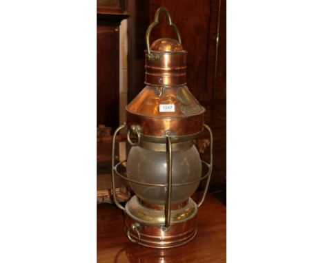 A copper ship's lantern labelled 'Anchor' and 'The Great Grimsby Coal, Salt and Tanning Company'