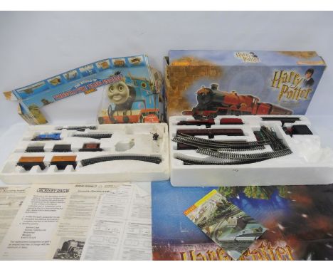 Two TV-related Hornby train sets: Harry Potter The Hogwarts Express and a Thomas the Tank Engine set, untested. 