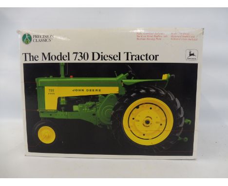 A boxed Precision Classics 1/16 scale John Deere 730 Diesel. 
