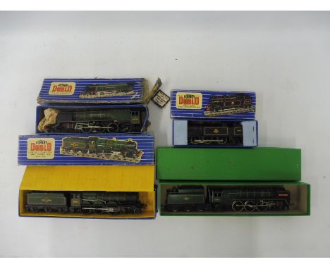 Four Hornby Duplo steam engines: the Oliver Cromwell, the Bristol Castle, The Duchess of Montrose and the 060 tank engine, al