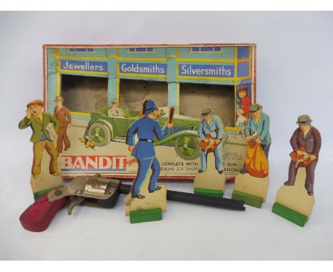 A period Chad Valley game circa between the wars - Bandit Shooting boxed game, with revolver and characters, overall VG condi