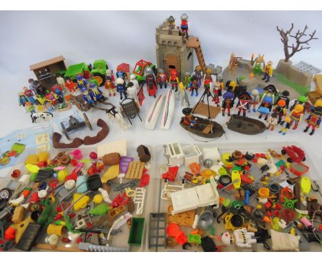 A quantity of vintage Playmobil, different eras and genres.