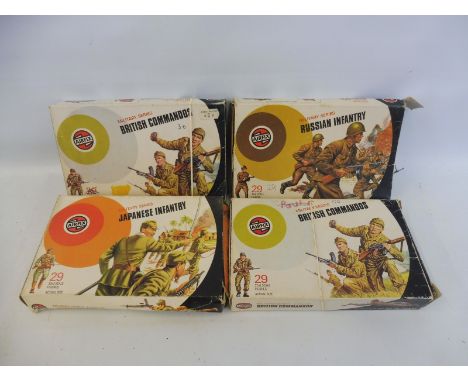 Four 1/32 scale circa 1970s Airfix plastic soldiers including British Commandos (x2), Russian and Japanese Infantry etc. 