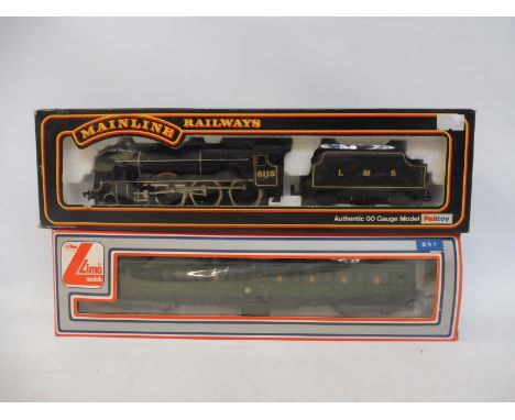 A Mainline 37-056 Scots Guardsman and a Lima diesel railcar, both boxed.