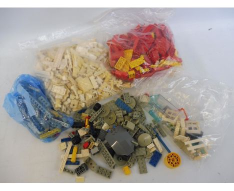 A small box of vintage Lego boards, blocks and accessories. 