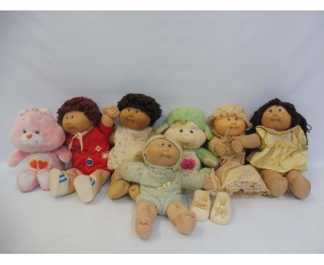 A box of original Cabbage Patch dolls.