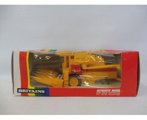 A boxed Britains no. 9571 New Holland TR85 Combine Harvester 1/32 scale in a Britains rainbow pack, box in good condition. 