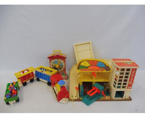 A box of vintage Fisher Price toys to include a garage and accessories. 