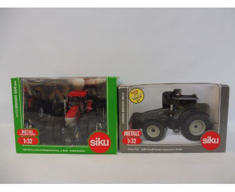 Two Siku 1/32 scale including the 3269 McCormick and a Valtra T161.