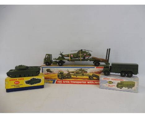 A boxed Dinky military 10-ton army truck, a Centurion tank and an AEC Artic with helicopter.