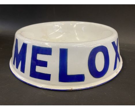 A Melox enamel dog food bowl. 