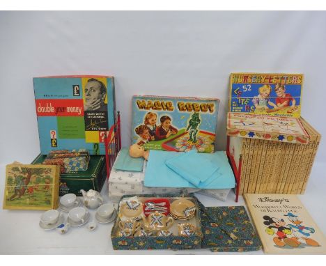 An interesting collection of assorted children's toys to include 'The Amazing Robot' by Merit, Nursery Letters, a boxed tea s